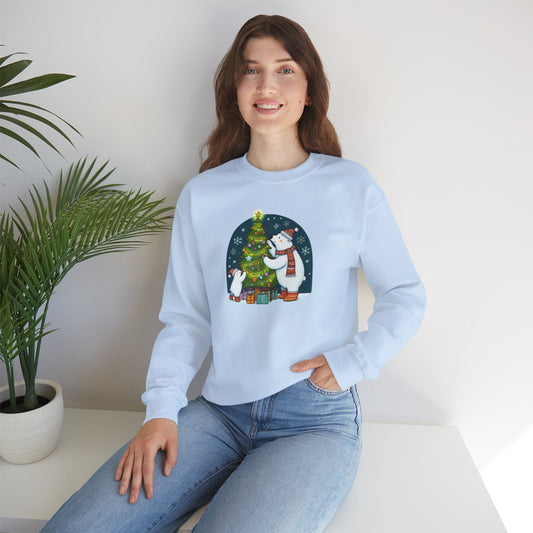 Woman wearing a light blue sweater with a Christmas design, sitting on a white surface with a plant in the background.