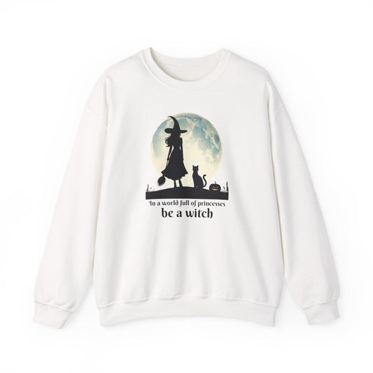 White sweatshirt with witch silhouette, full moon, cat, and text “In a world full of princesses, be a witch.”