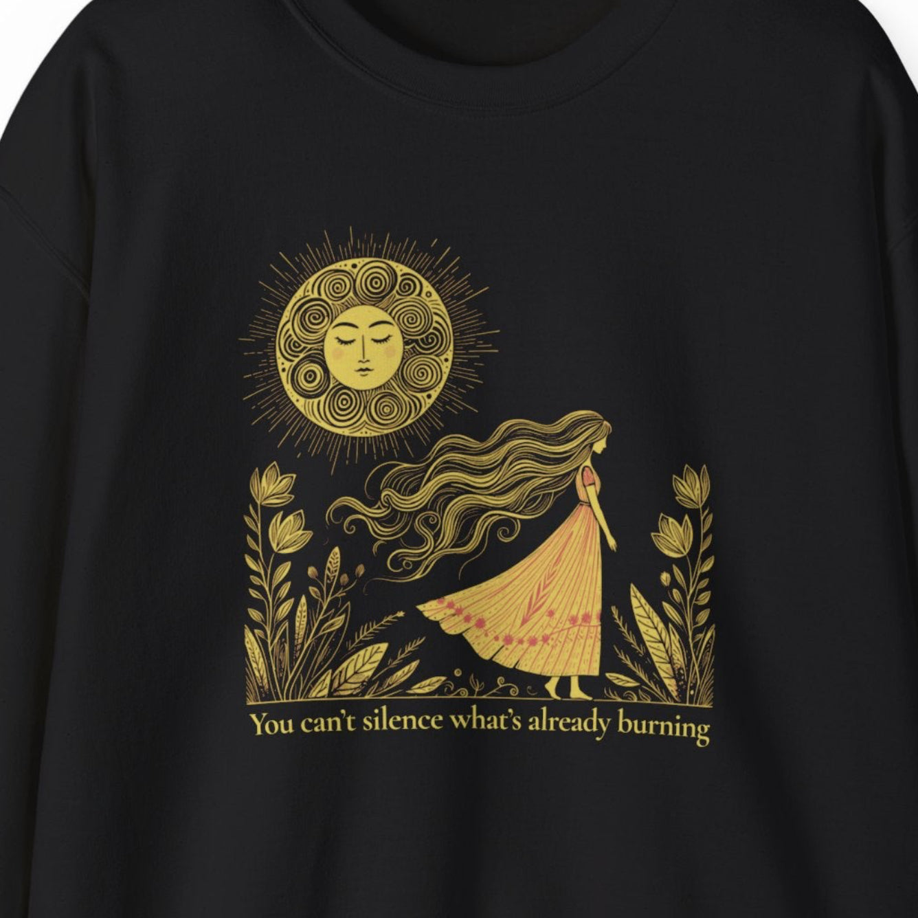 Black sweatshirt with gold graphic design on a white background