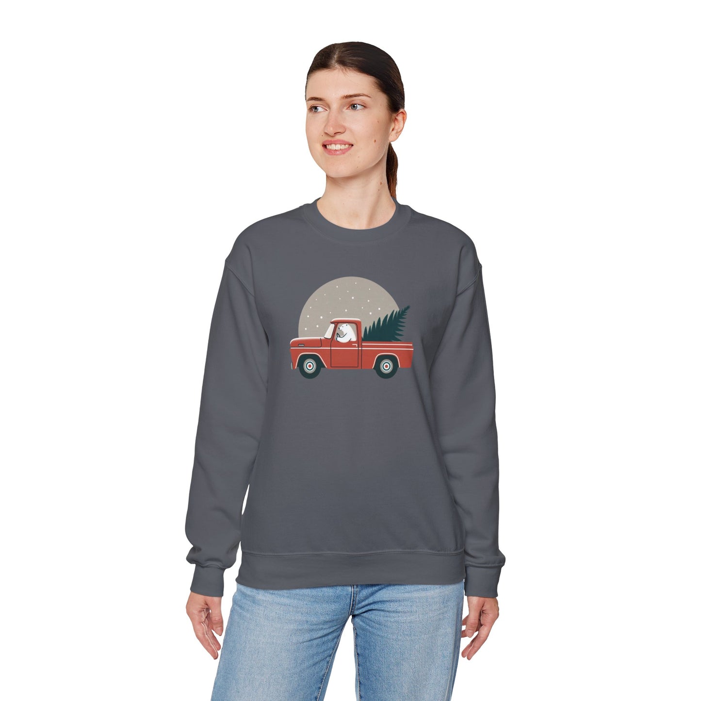 Person wearing a gray sweatshirt with a graphic of a polar bear driving a red truck carrying a Christmas tree.