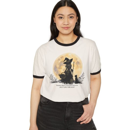 Person wearing a white t-shirt with a colorful graphic design on a white background