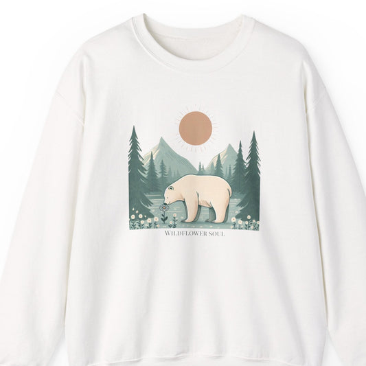 White sweatshirt with a bear and forest graphic on a white background