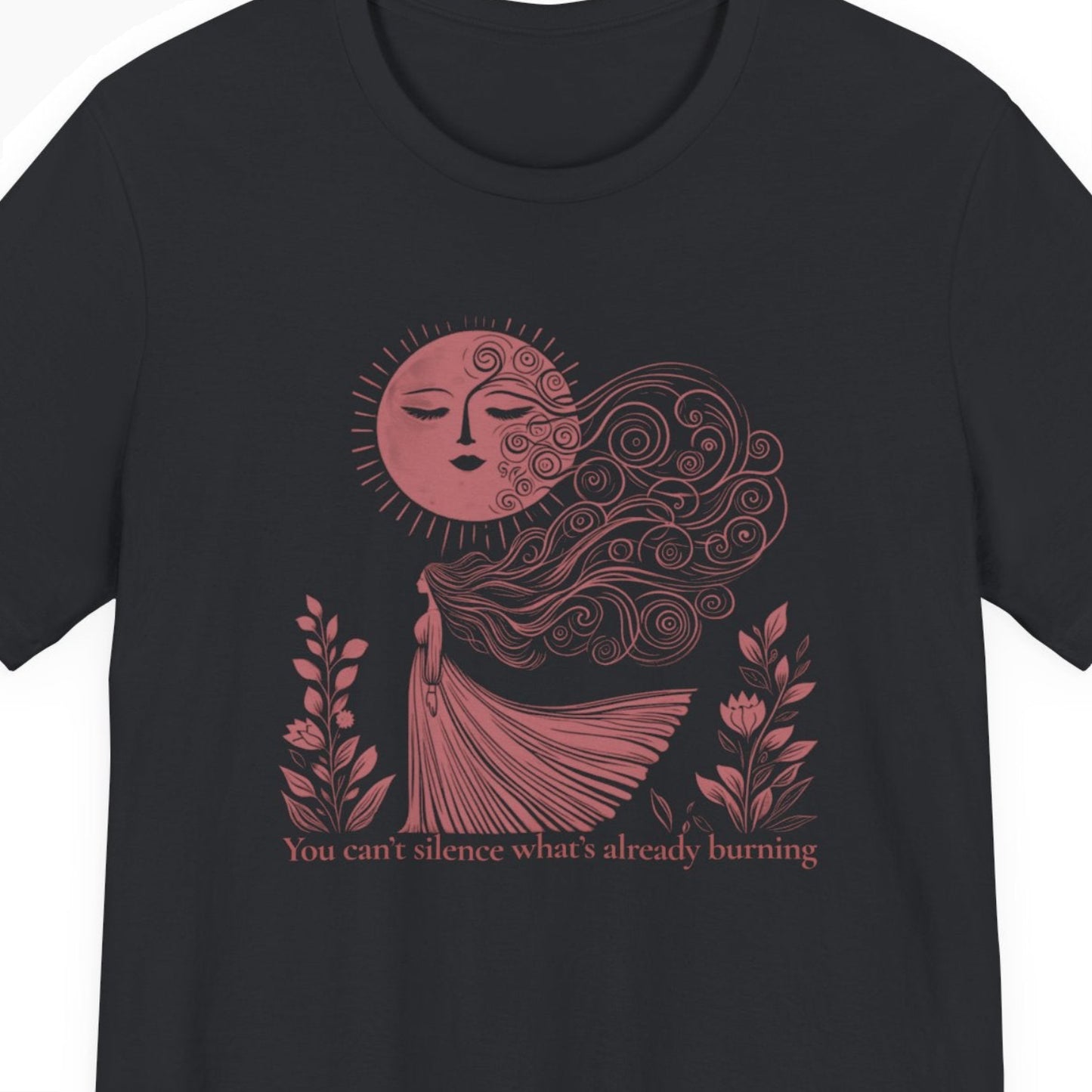 Black t-shirt with red sun and woman graphic and text on a white background