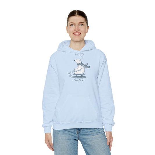 Woman wearing a light blue hoodie with a polar bear graphic on a white background