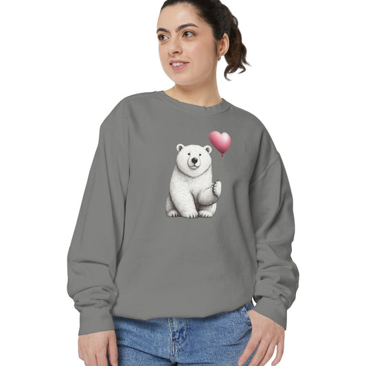 Woman wearing a gray sweatshirt with a polar bear and heart design on a white background