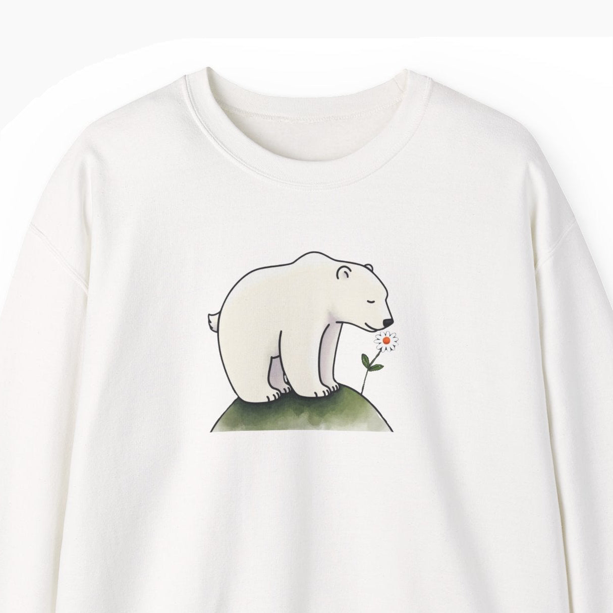 White sweatshirt with a polar bear graphic on a white background