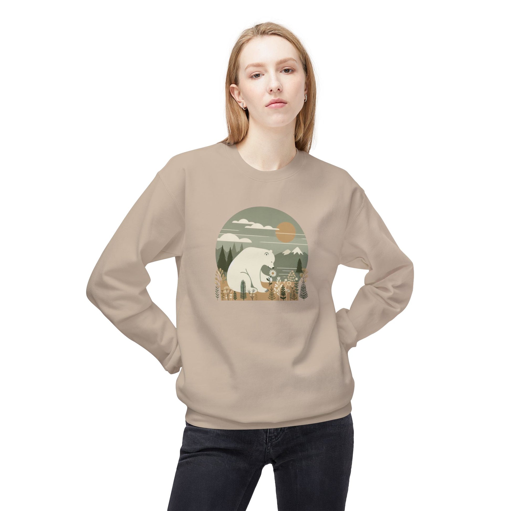 Person wearing a beige sweatshirt with a graphic design of a bear and trees.