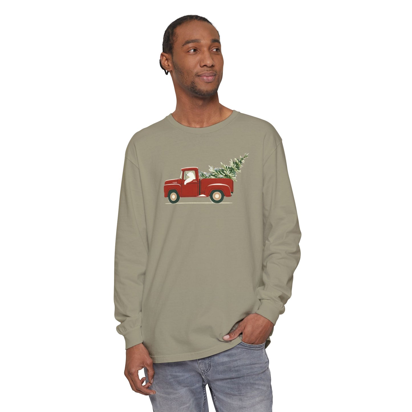 Man wearing a long-sleeve shirt with a red truck and Christmas tree design on a white background