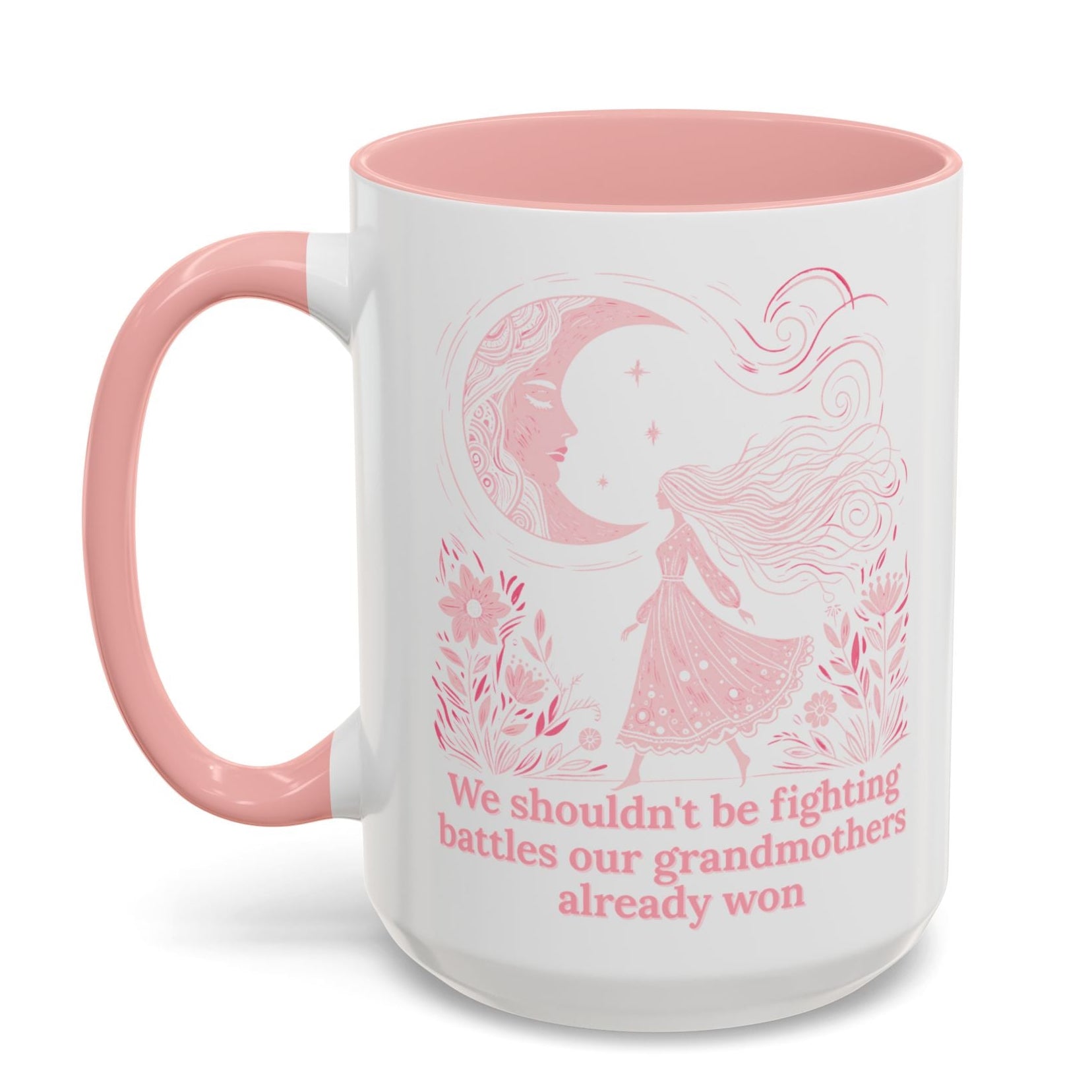 White mug with pink interior and handle, featuring a design and text on a white background