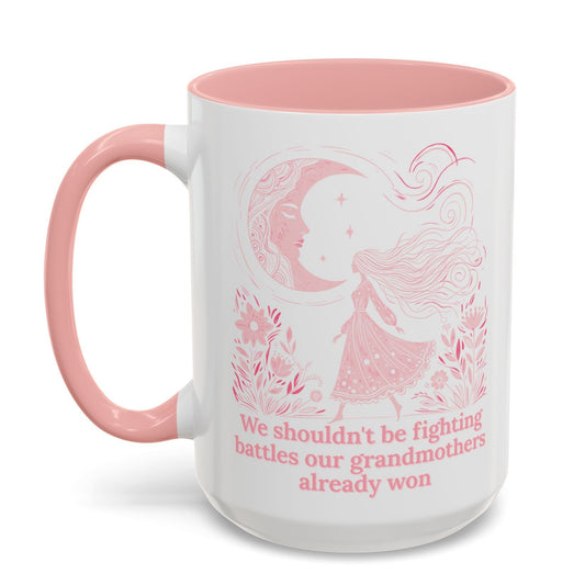 White mug with pink interior and handle, featuring a design and text on a white background