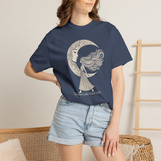 Person wearing a navy blue t-shirt with a gold emblem design on a beige background