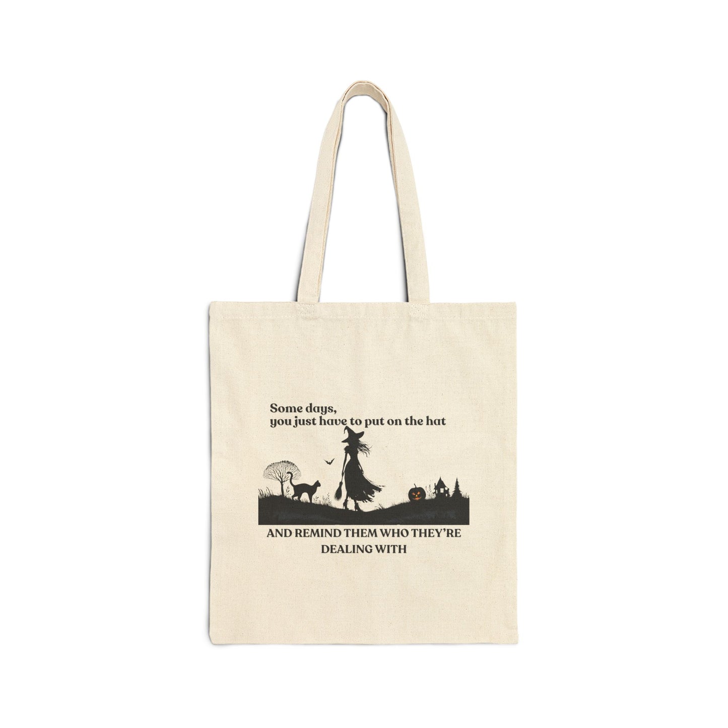 Beige tote bag with black witch and cat  silhouette design and text on a white background