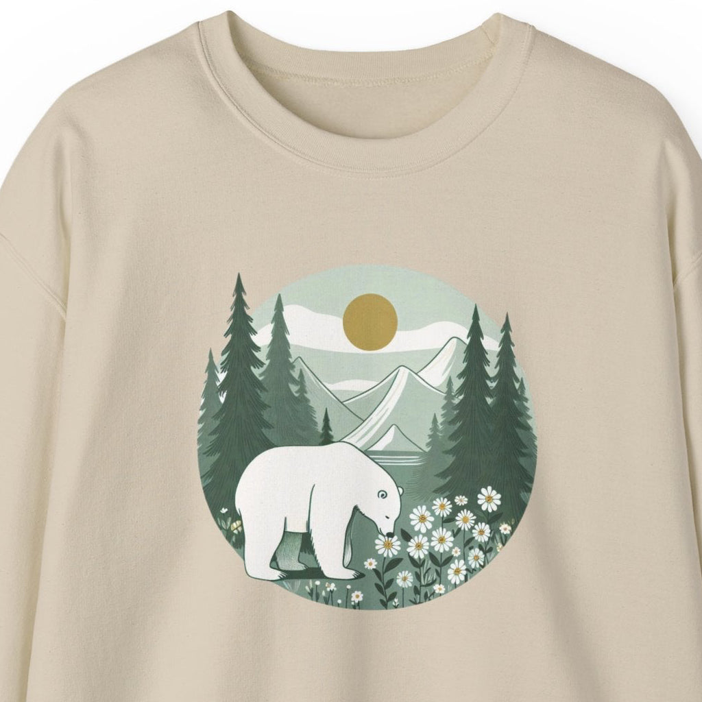 Beige sweatshirt with a graphic of a polar bear, trees, and flowers on a white background