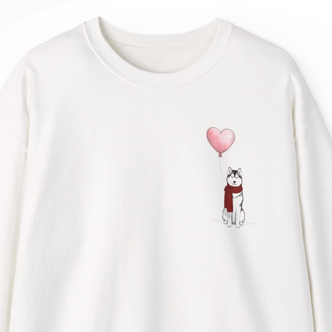 White sweatshirt with a husky dog holding a pink heart balloon on a white background