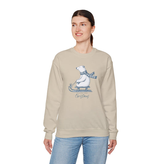 Woman wearing a beige sweatshirt with a Christmas polar bear graphic on a white background