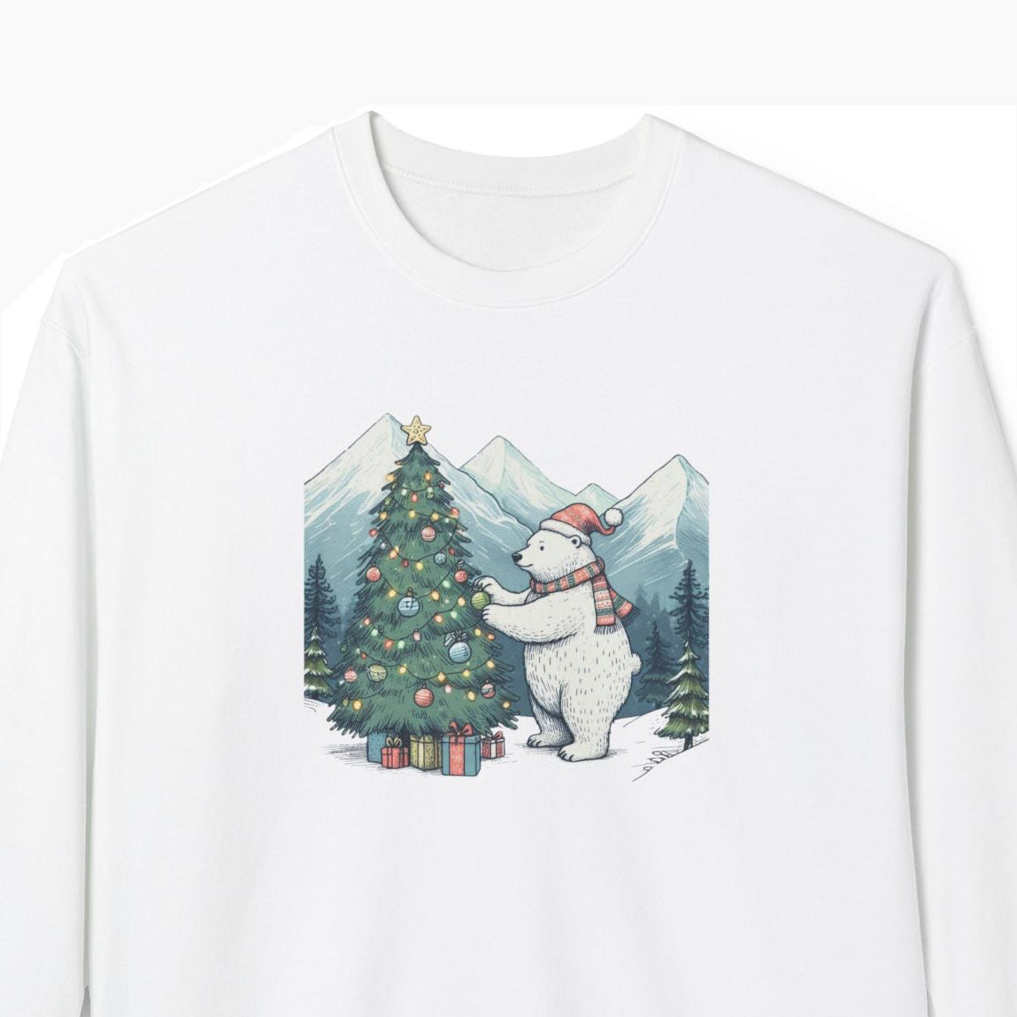 White sweatshirt with a graphic of a polar bear decorating a Christmas tree in a mountainous landscape.