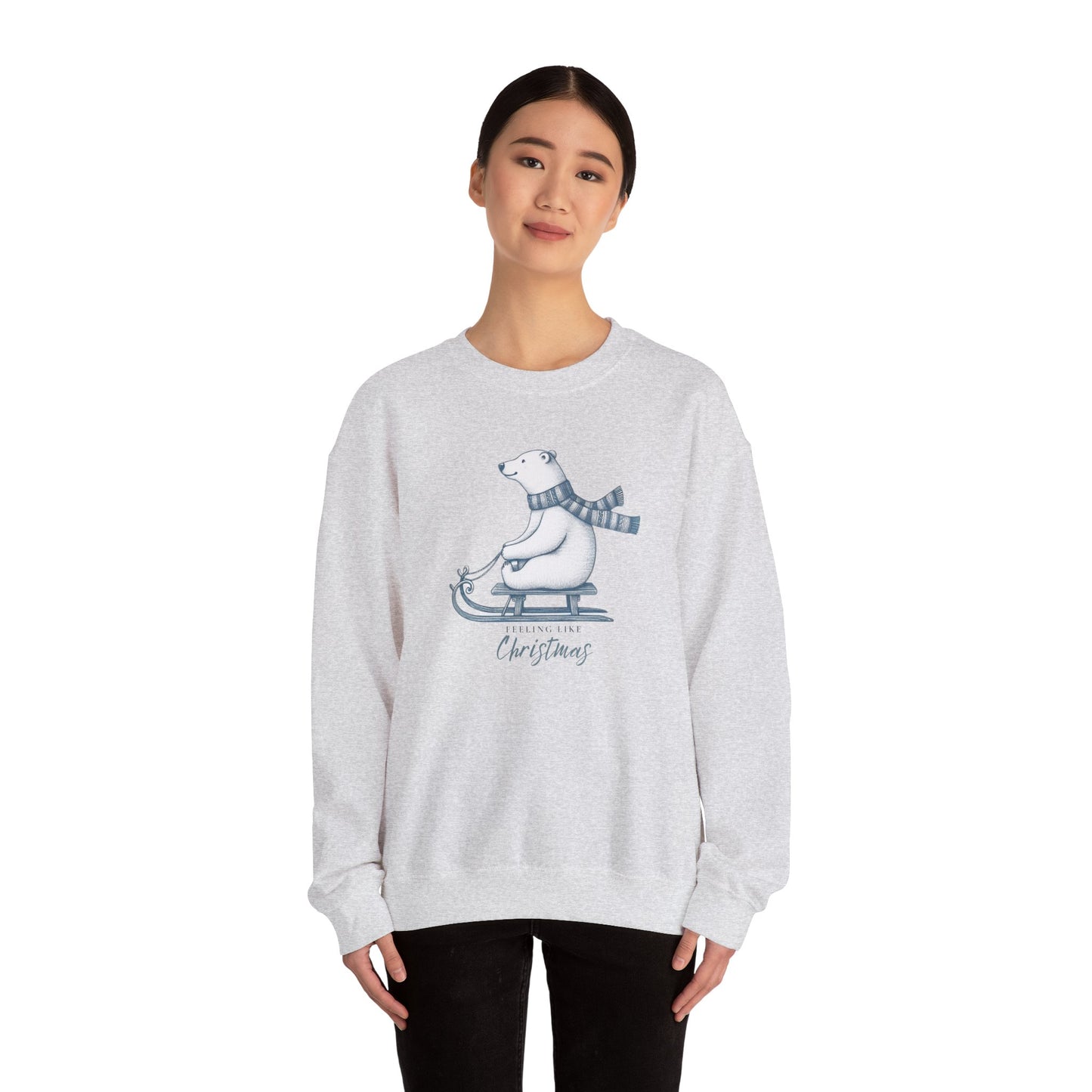 Person wearing a gray sweatshirt with a Christmas polar bear graphic on a white background