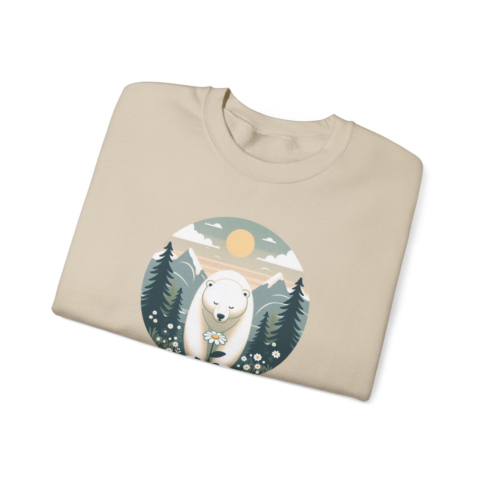 Folded beige sweatshirt with a polar bear graphic on a white background