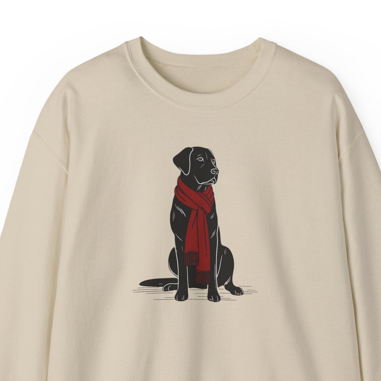 Beige sweatshirt with a black dog wearing a red scarf on a white background