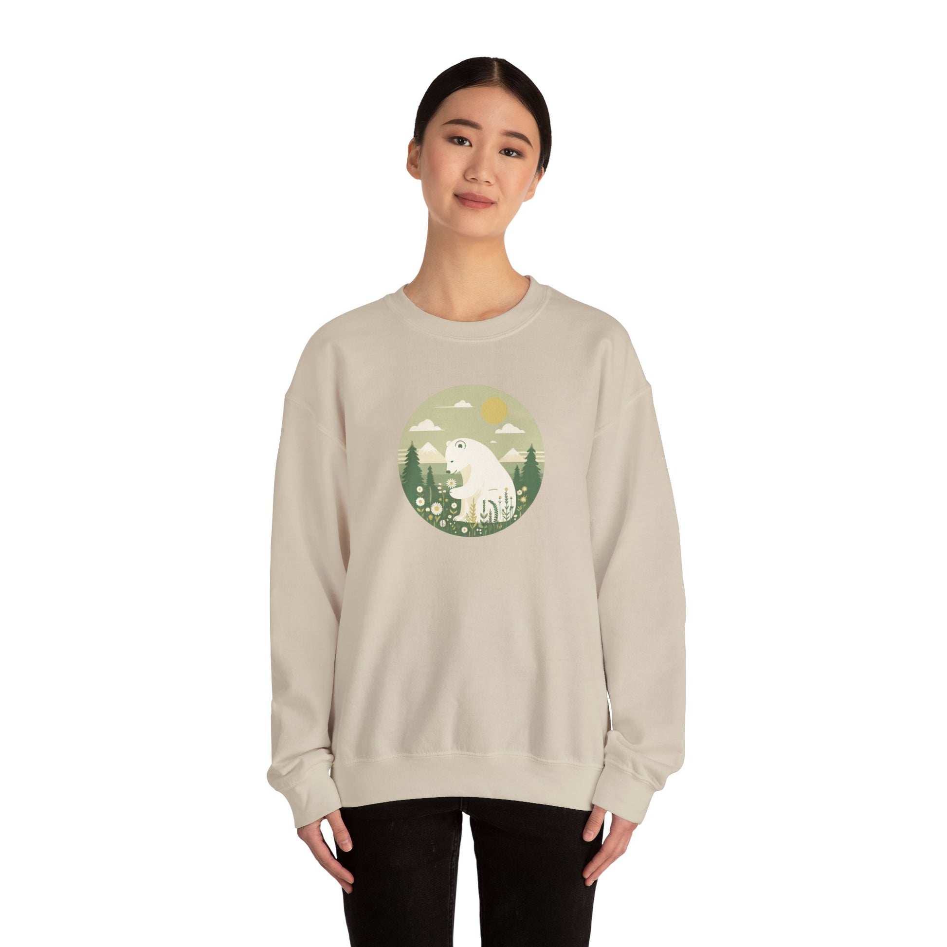 Person wearing a beige sweatshirt with a graphic design on a white background