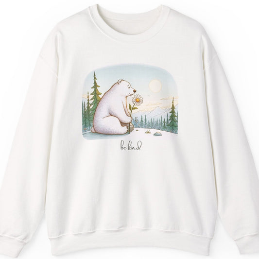 White sweatshirt with a bear holding a flower graphic and 'be kind' text on a white background