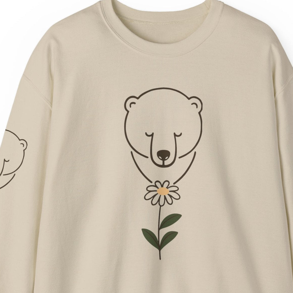 Beige sweatshirt with polar bear and flower design on a white background