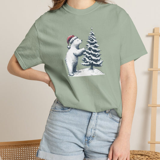 Person wearing a green t-shirt with a bear and tree design, standing against a neutral background.
