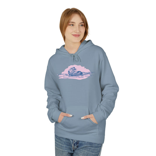 Person wearing a light blue hoodie with a pink graphic design of a sea otter 
