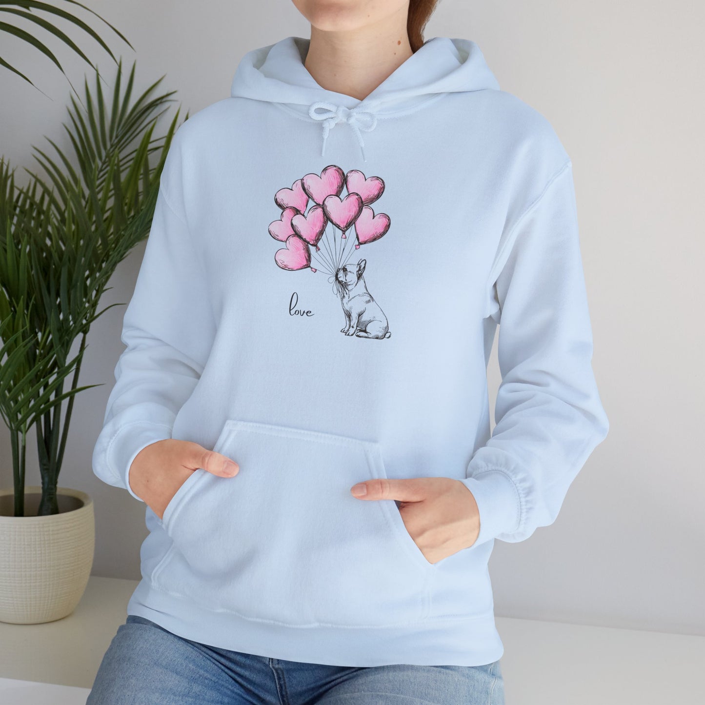 Light blue hoodie with a French Bulldog and heart balloon design on a neutral background