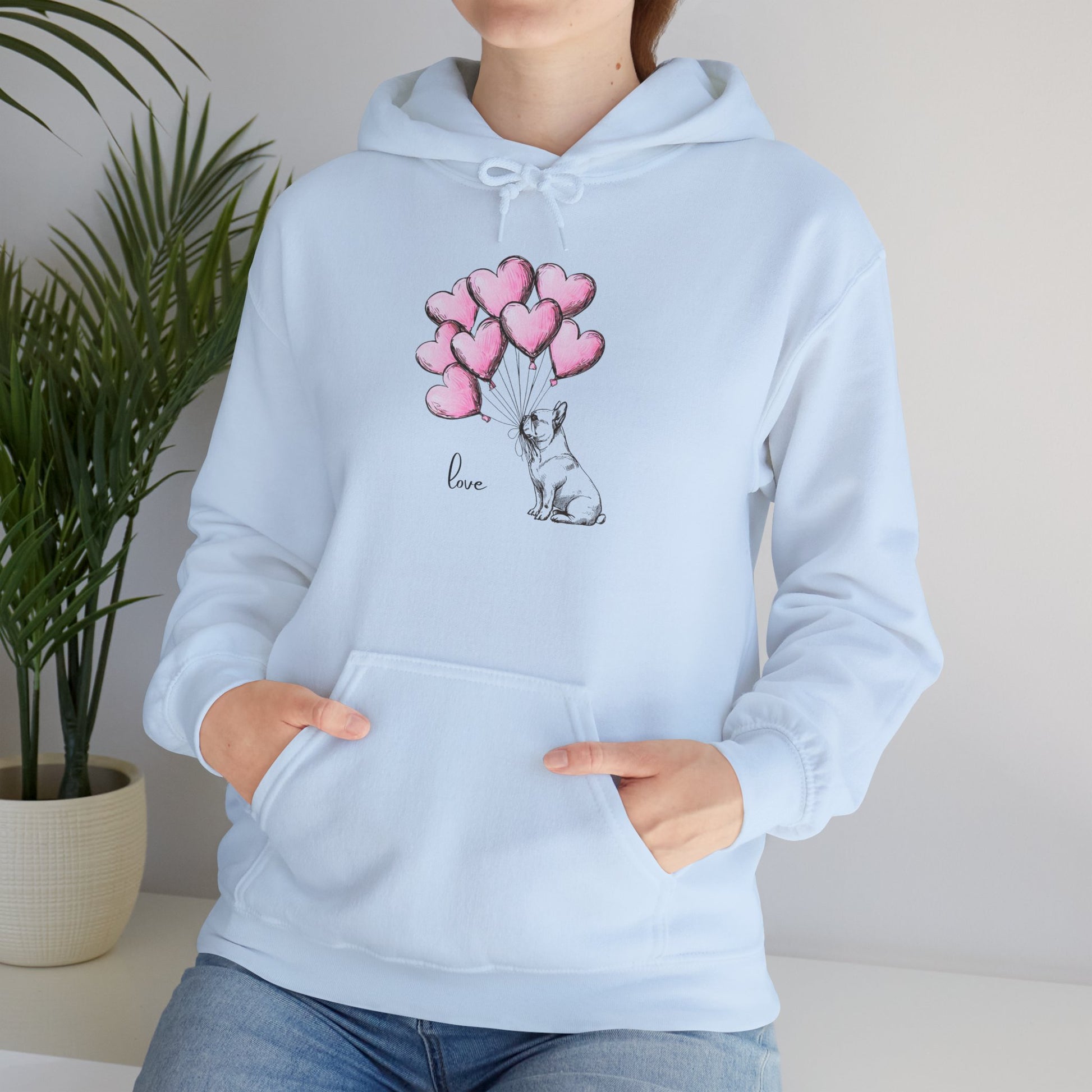 Light blue hoodie with a French Bulldog and heart balloon design on a neutral background