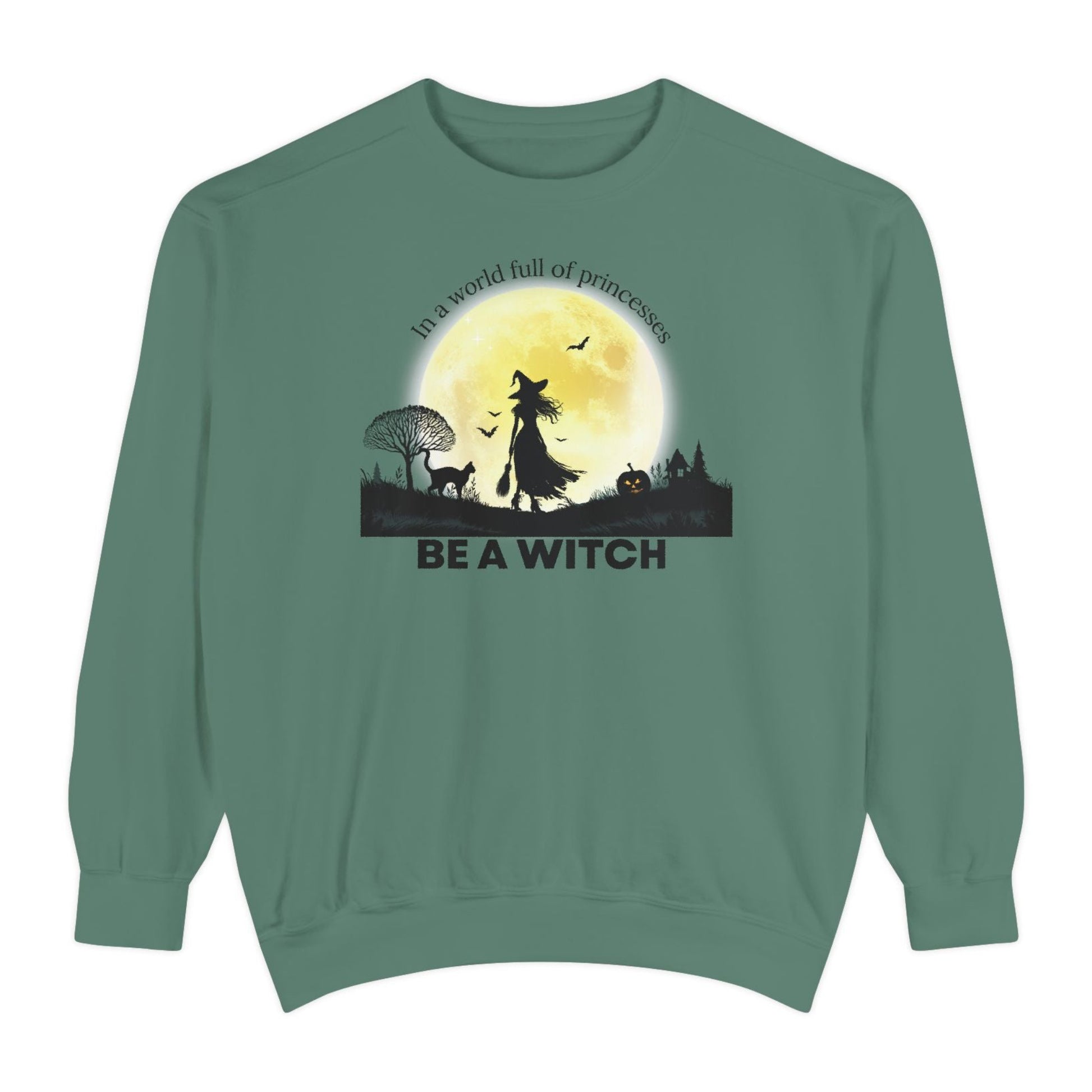 Green sweatshirt with witch graphic and text on a white background