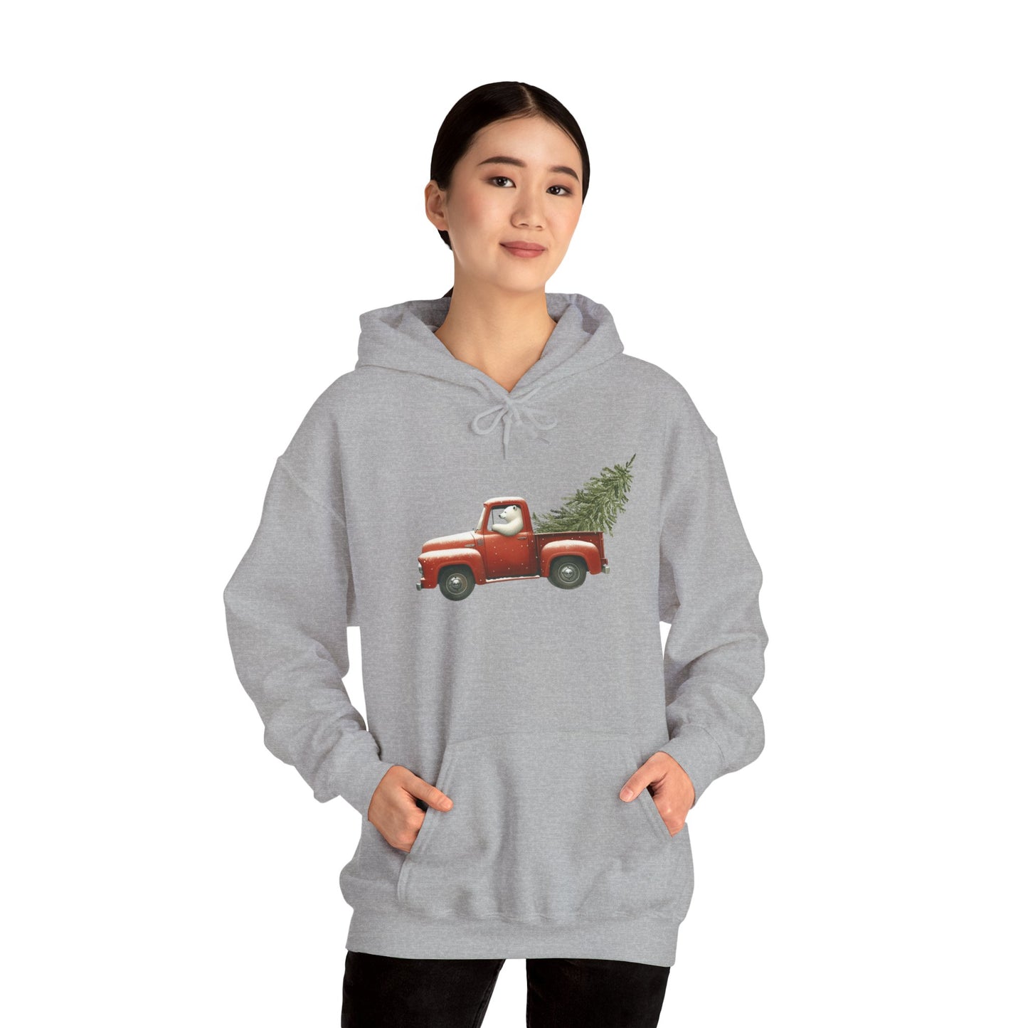 Gray hoodie with red truck and Christmas tree design worn by a person on a white background