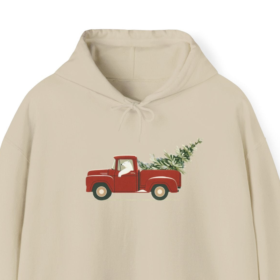 Beige hoodie with a red truck and Christmas tree design on a white background