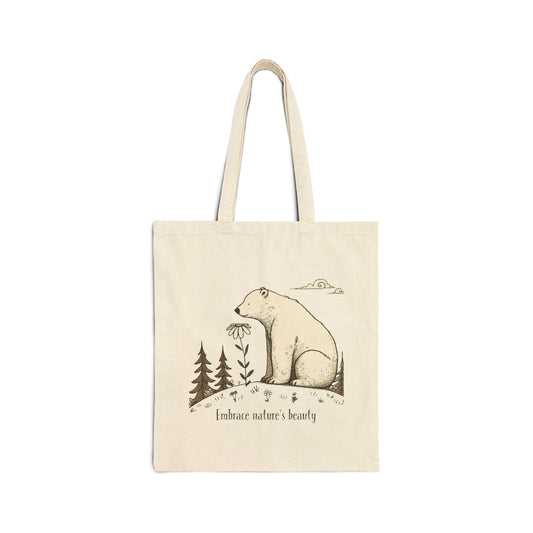 Eco-friendly canvas tote bag with polar bear graphic, daisy flower, and pine trees, “Embrace nature’s beauty” design.