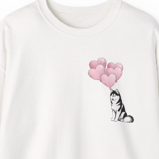 White sweatshirt with a dog and heart balloon design on a white background