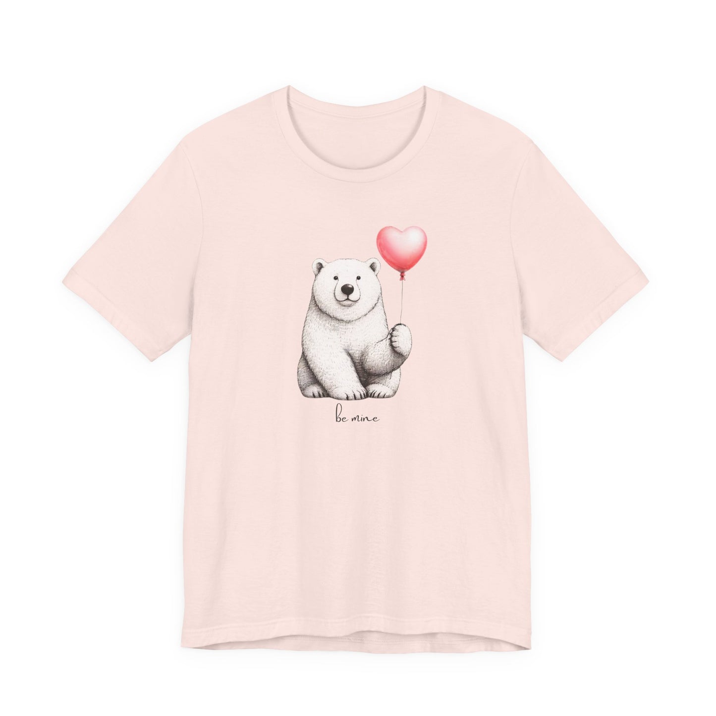 Pink t-shirt with a polar bear holding a heart-shaped balloon and 'be mine' text on a white background