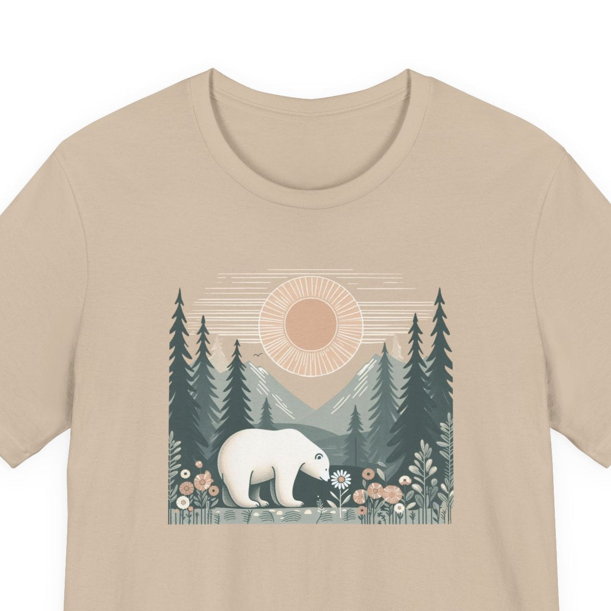 Beige t-shirt with a graphic of a polar bear in a forest design on a white background