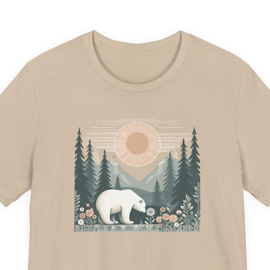 Beige t-shirt with a graphic of a polar bear in a forest design on a white background