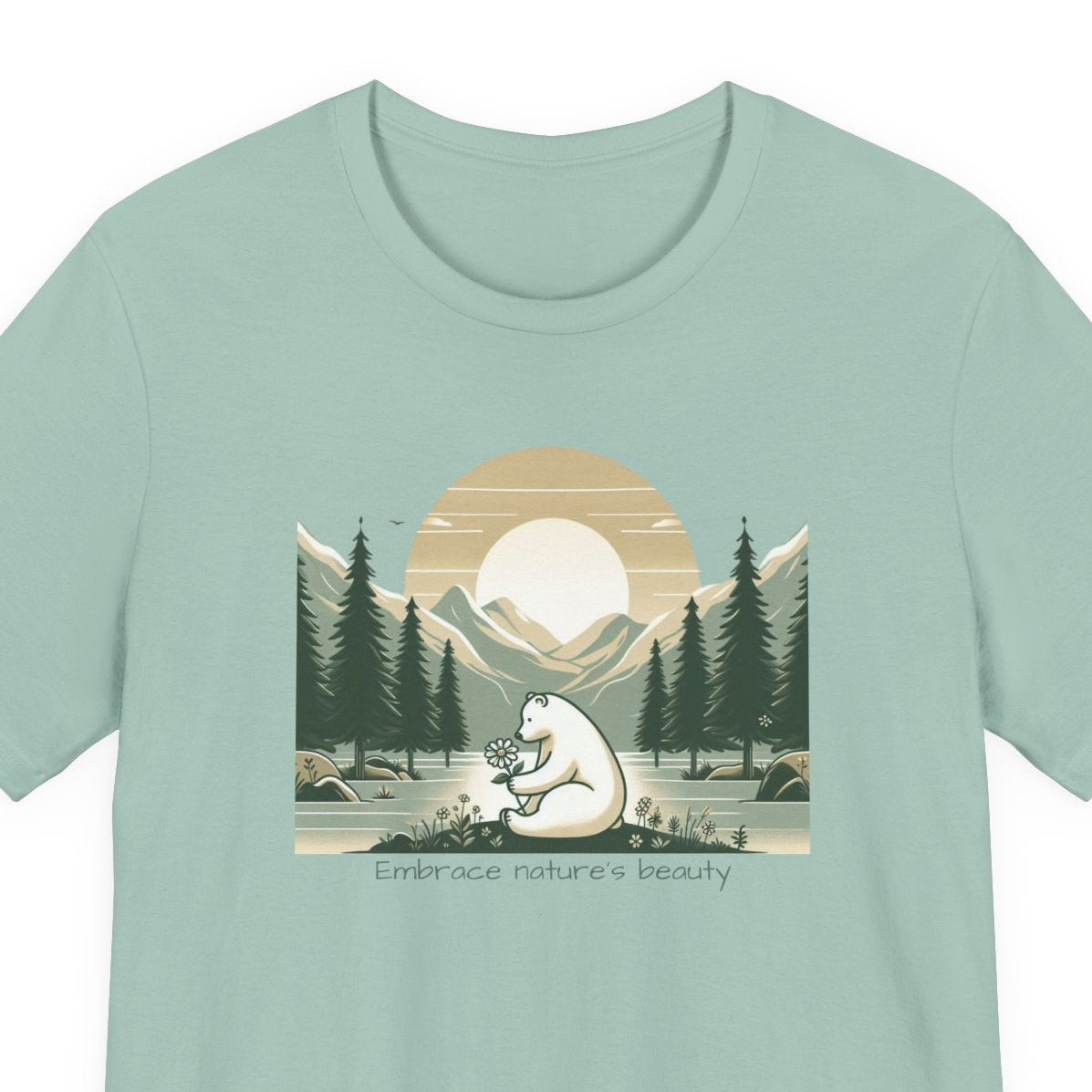 Mint green t-shirt with a bear and nature graphic on a white background