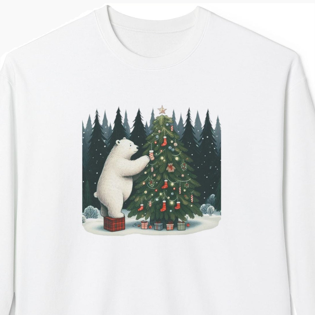 White sweatshirt with a graphic of a polar bear decorating a Christmas tree in a forest.